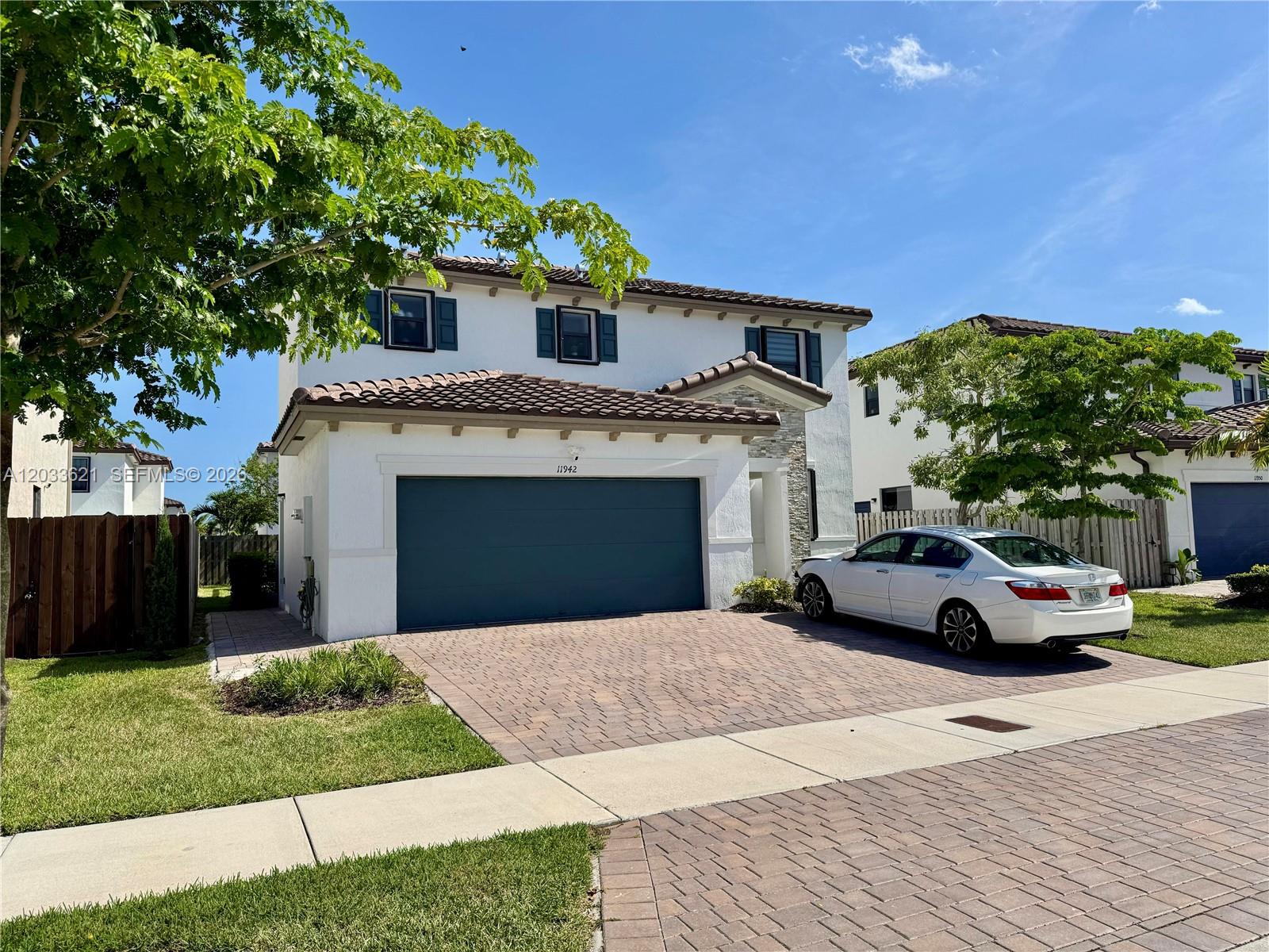 11942 Southwest 243rd Street Homestead, FL 33032 - Photo 2 of 50 a view of front a house with a yard