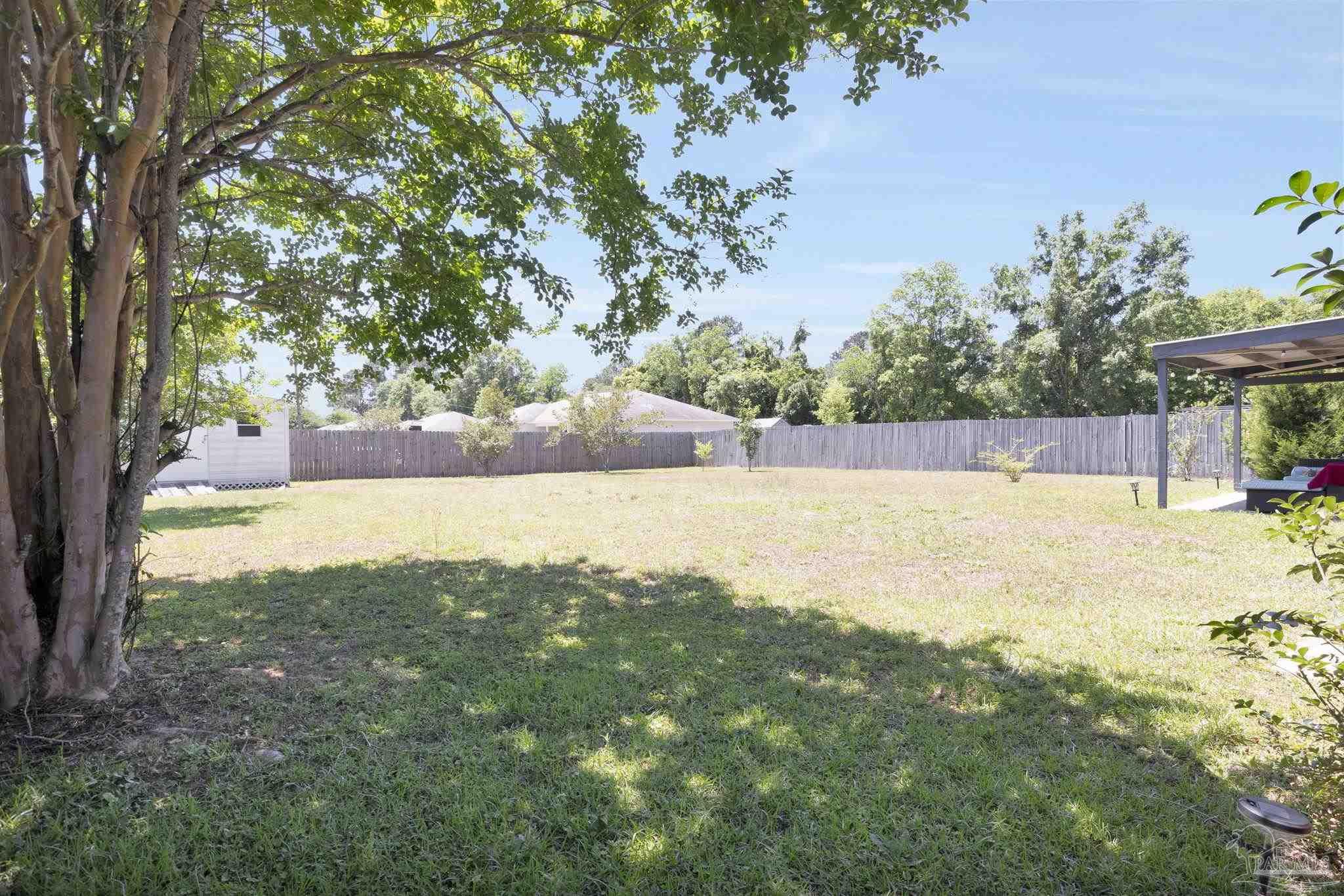 5539 Windrun Place Pace, FL 32571 - Photo 48 of 62 a view of a backyard