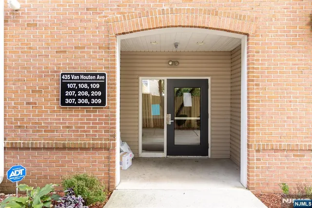 a view of a door with brick wall