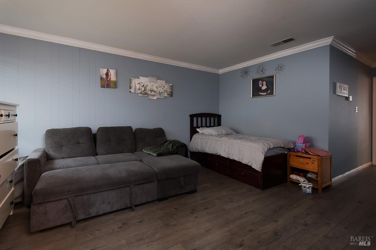 22 Fairfax Street, Unit E San Rafael, CA 94901 - Photo 2 of 7 a living room with furniture and a wooden floor