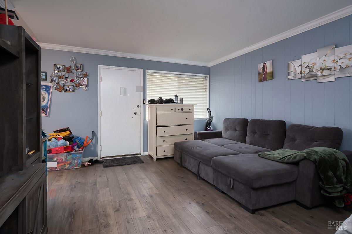 22 Fairfax Street, Unit E San Rafael, CA 94901 - Photo 4 of 7 a living room with furniture and a wooden floor