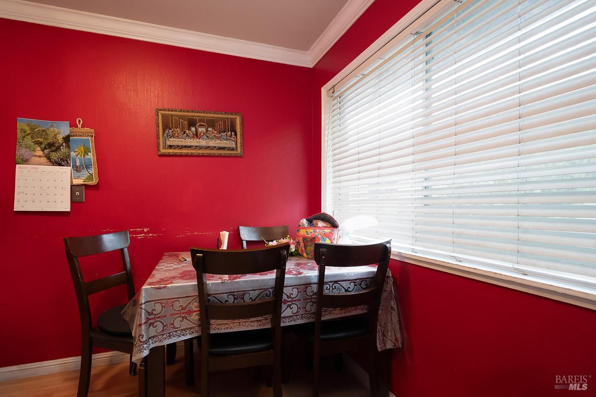 22 Fairfax Street, Unit E San Rafael, CA 94901 - Photo 6 of 7 a view of a dining room with furniture and a window