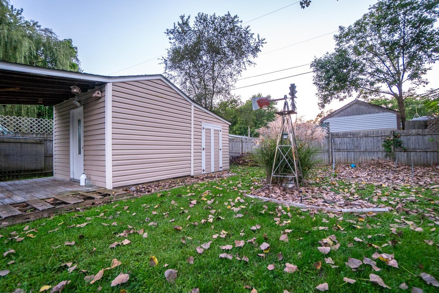 704-1 Juniper Road Valparaiso, IN 46385 - Photo 5 of 10 a view of a backyard with plants and large tree