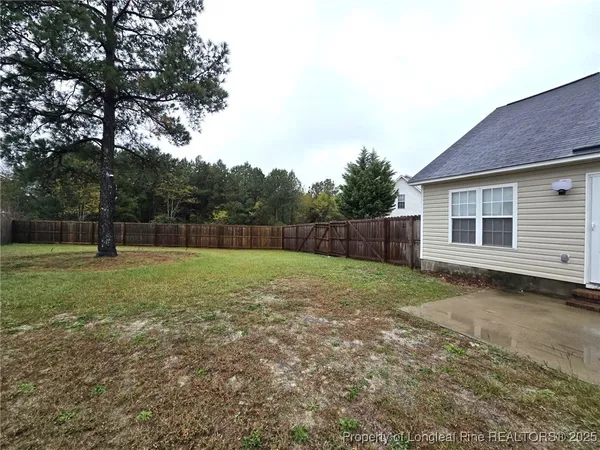a backyard of a house with lots of green space
