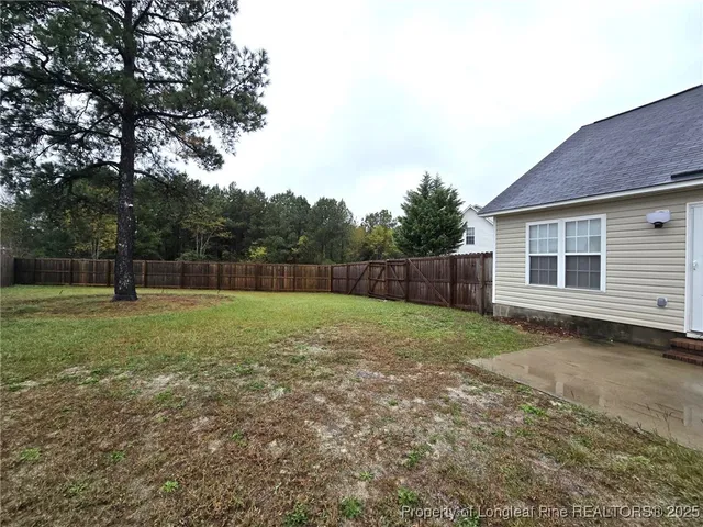 a backyard of a house with lots of green space