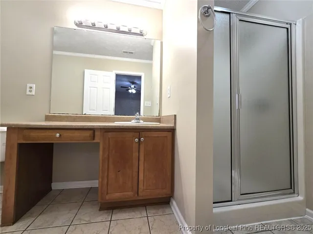 a bathroom with a sink a vanity and a mirror