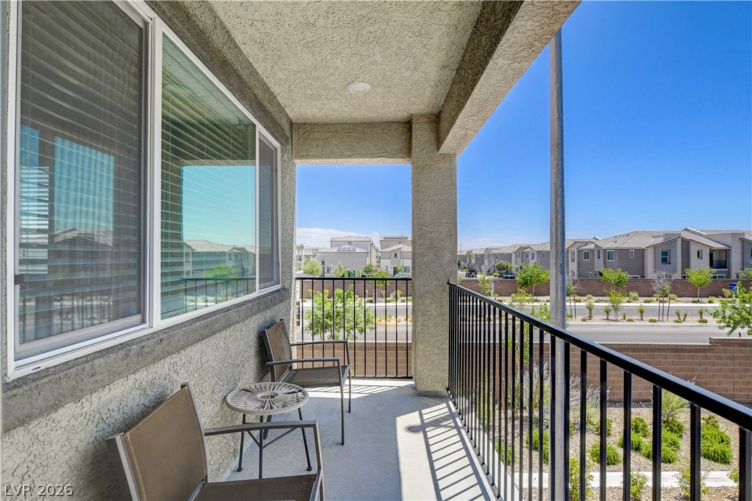 6924 Spicy Merlot Street North Las Vegas, NV 89086 - Photo 39 of 83 An inviting balcony offers serene outdoor relaxation with distant views of residential rooftops.
