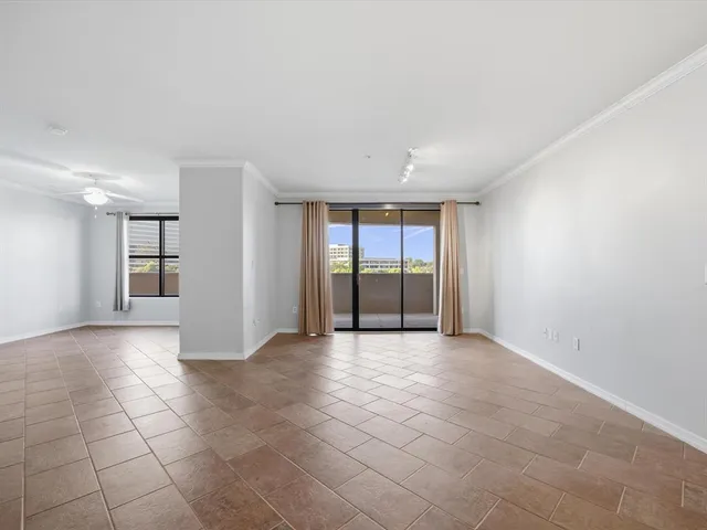 a view of a kitchen with a sink and cabinets