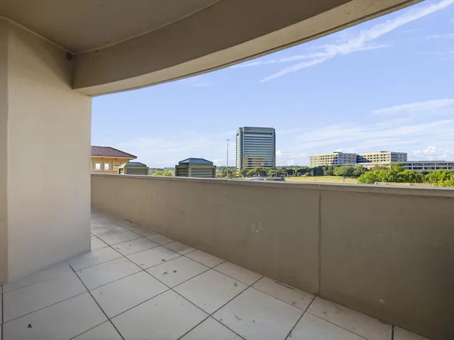 a view of balcony with furniture