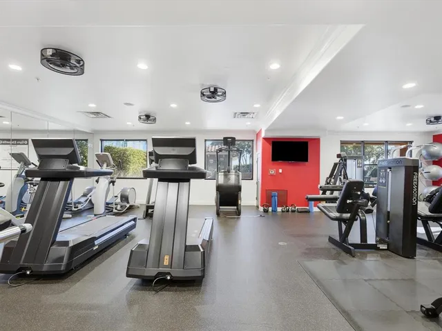 a living room with lots of furniture and a window