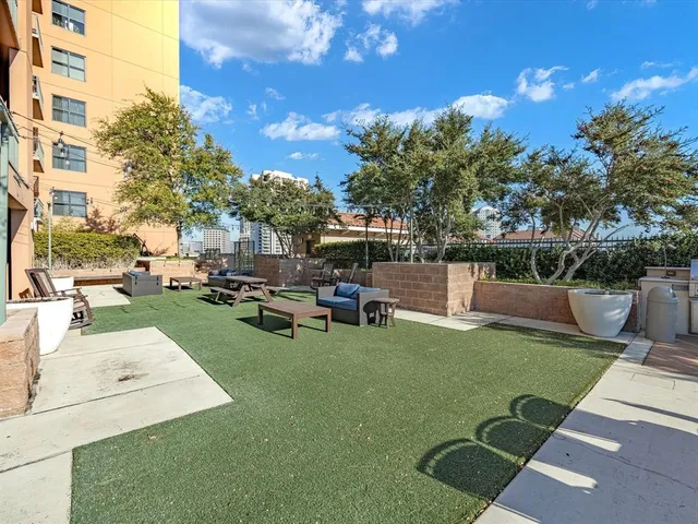 a view of a patio with table and chairs