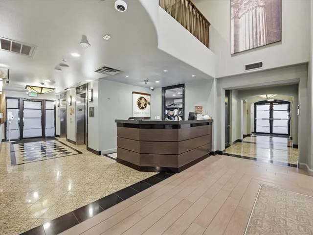 a view of a living room and kitchen