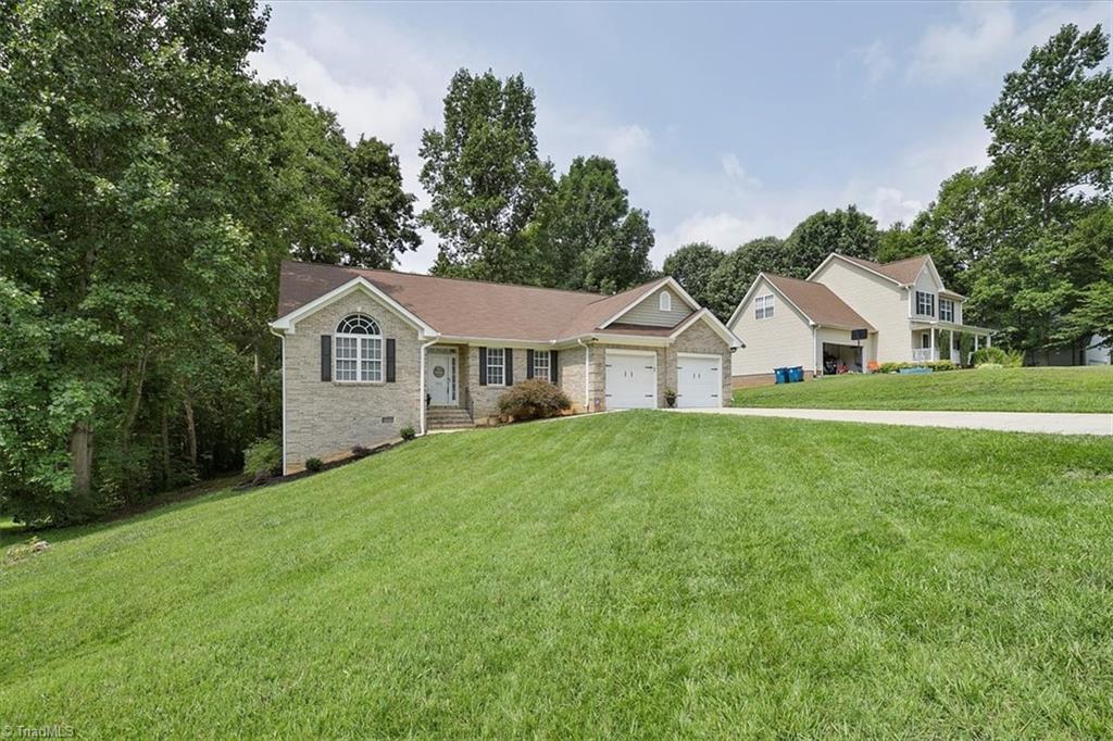 7521 Kristen Drive Oak Ridge, NC 27310 - Photo 3 of 34 Great wooded privacy in back!