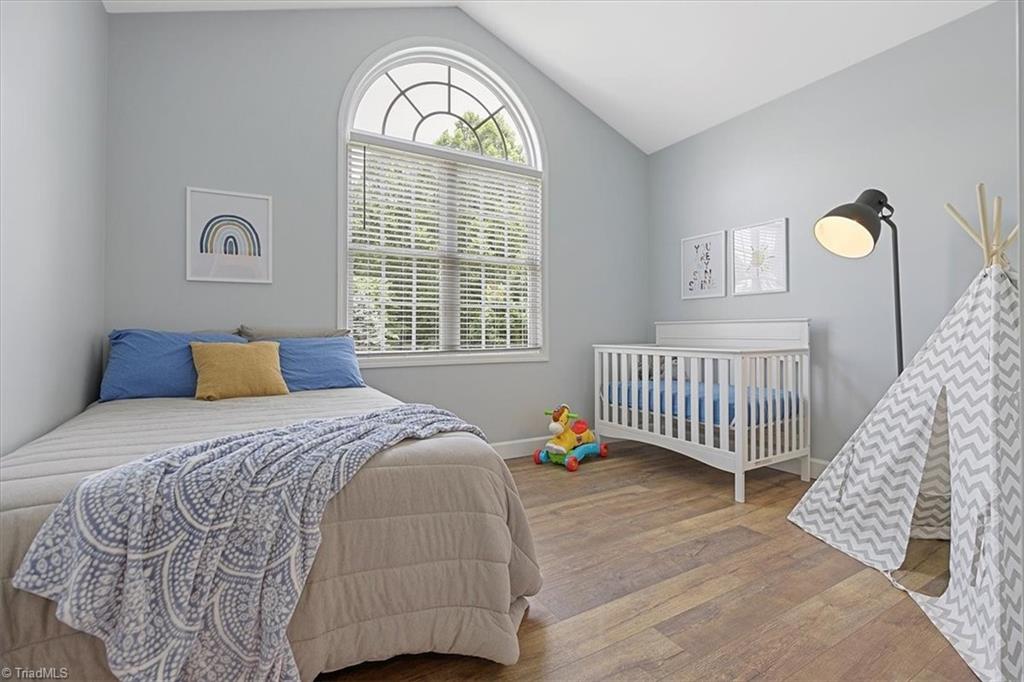 7521 Kristen Drive Oak Ridge, NC 27310 - Photo 25 of 34 Love the Palladium window in this good sized third bedroom ~ ALL the Bedrooms have the new flooring!