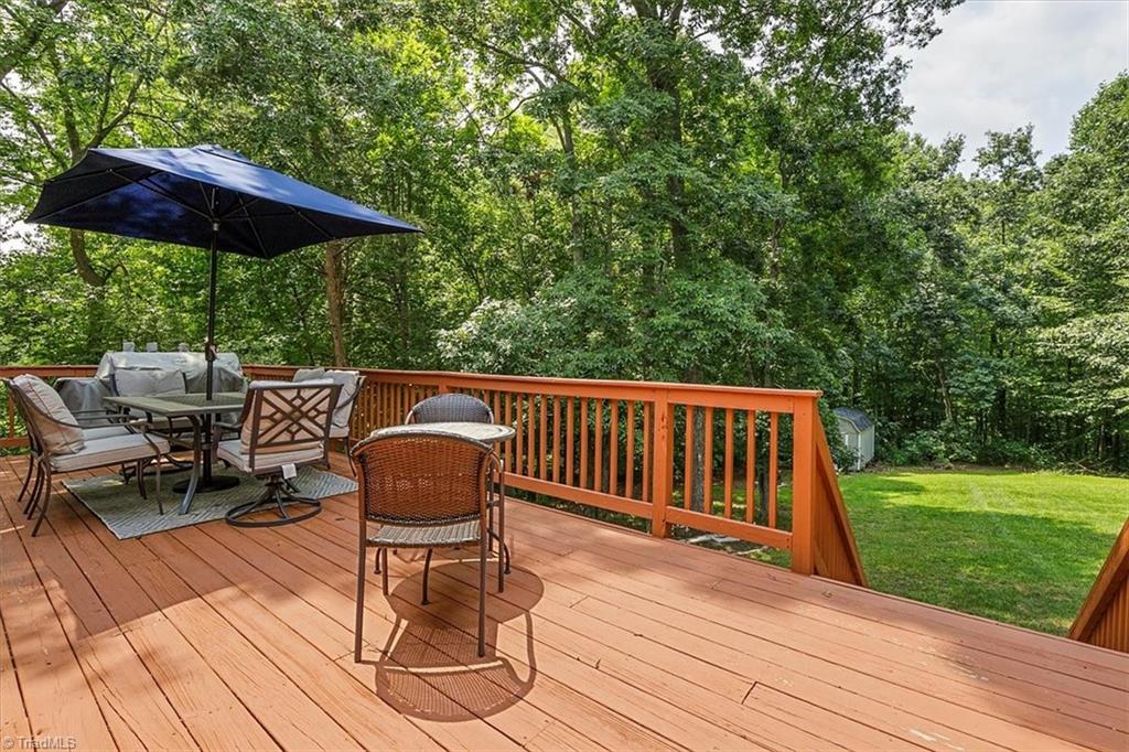 7521 Kristen Drive Oak Ridge, NC 27310 - Photo 28 of 34 Great sized deck for lots of entertaining!