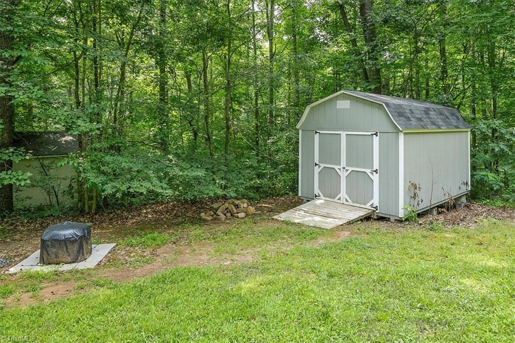 7521 Kristen Drive Oak Ridge, NC 27310 - Photo 30 of 34 Storage building in rear