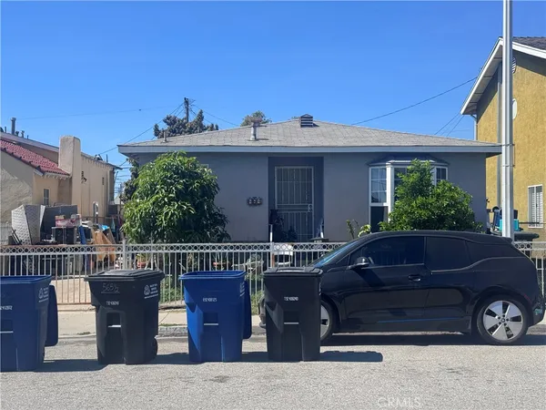 a view of a car parked in front of house