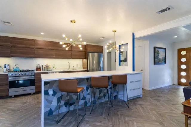 a kitchen with a table and chairs in it