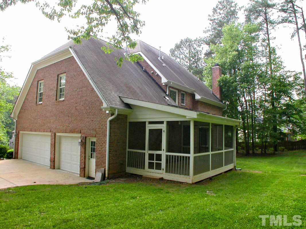 5409 Levering Mill Road Apex, NC 27539 - Photo 3 of 22 a view of a house with a yard and large trees