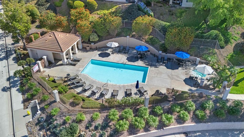 an aerial view of a house with a swimming pool yard and outdoor seating