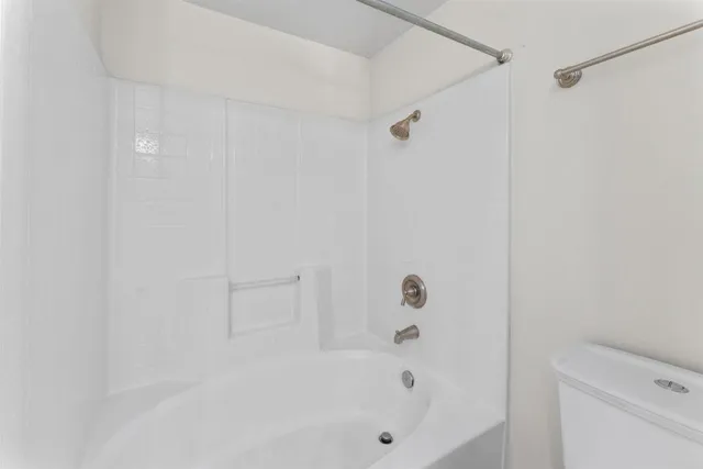 a kitchen that has a sink and a stove in it