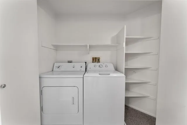 a bathroom with a sink vanity granite and toilet