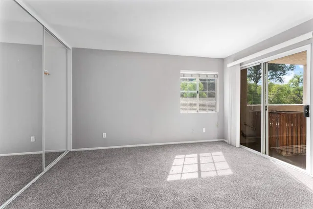 an aerial view of a house with swimming pool and patio