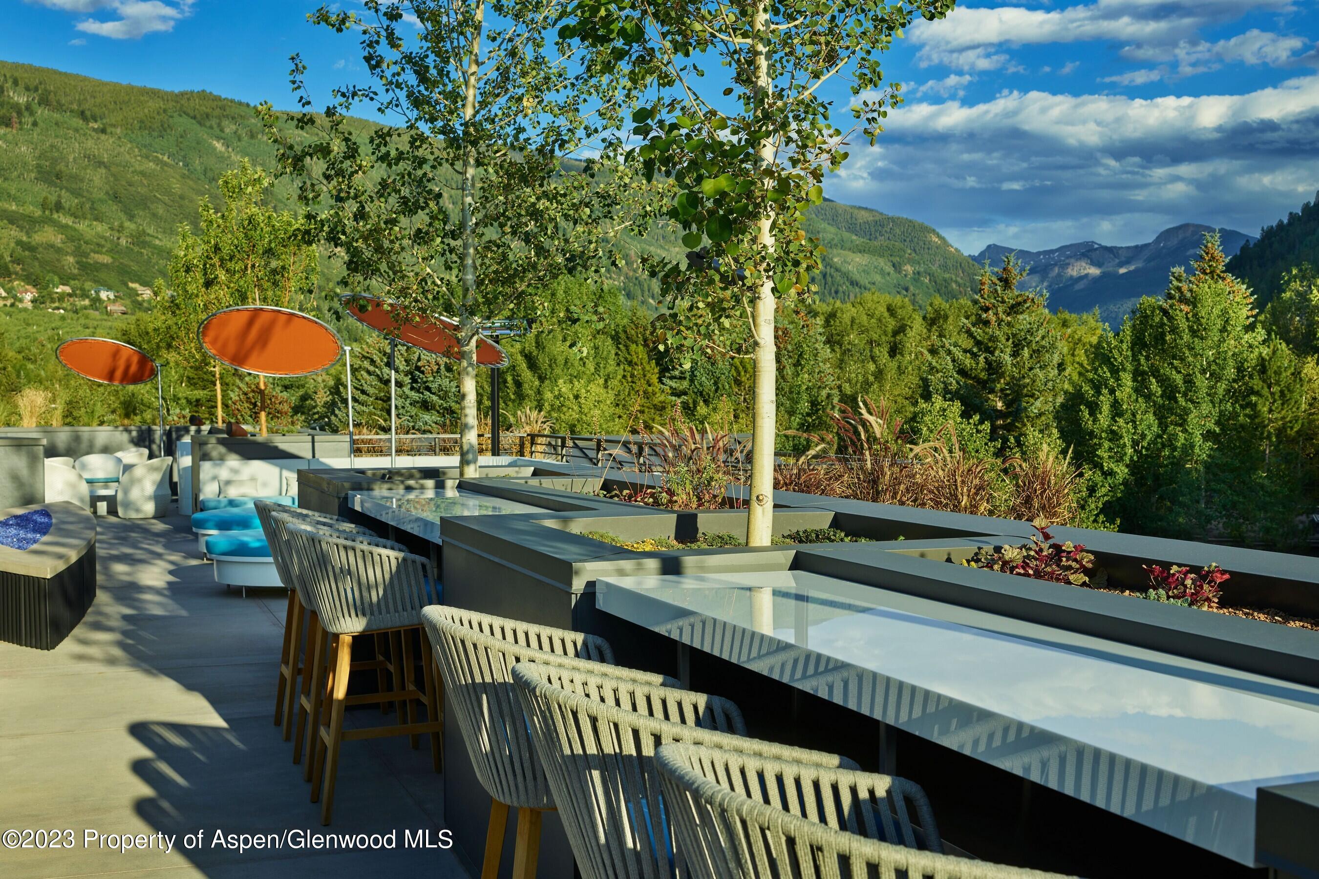 550 South Spring Street, Unit F10 110 Aspen, CO 81611 - Photo 51 of 58 an outdoor sitting area with furniture and city view