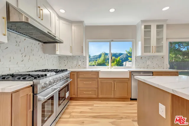a bathroom with a granite countertop sink toilet and a mirror