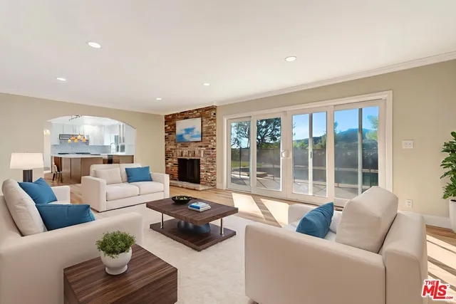 a bedroom with a large bed and a large window