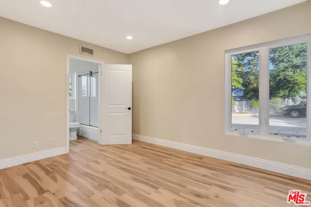 a view of a bathroom with wooden floor
