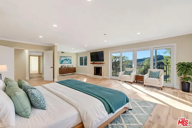 a bathroom with a granite countertop sink mirror and a bathtub