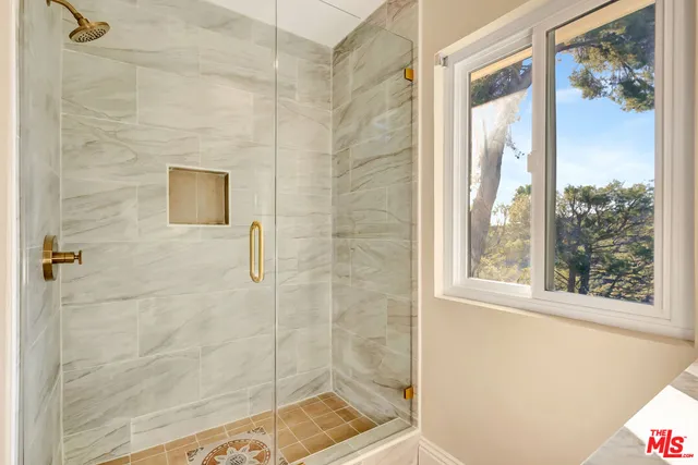 a view of backyard with swimming pool table and chairs