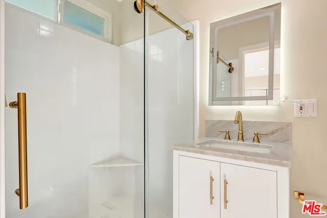 a front view of a house with swimming pool having outdoor seating