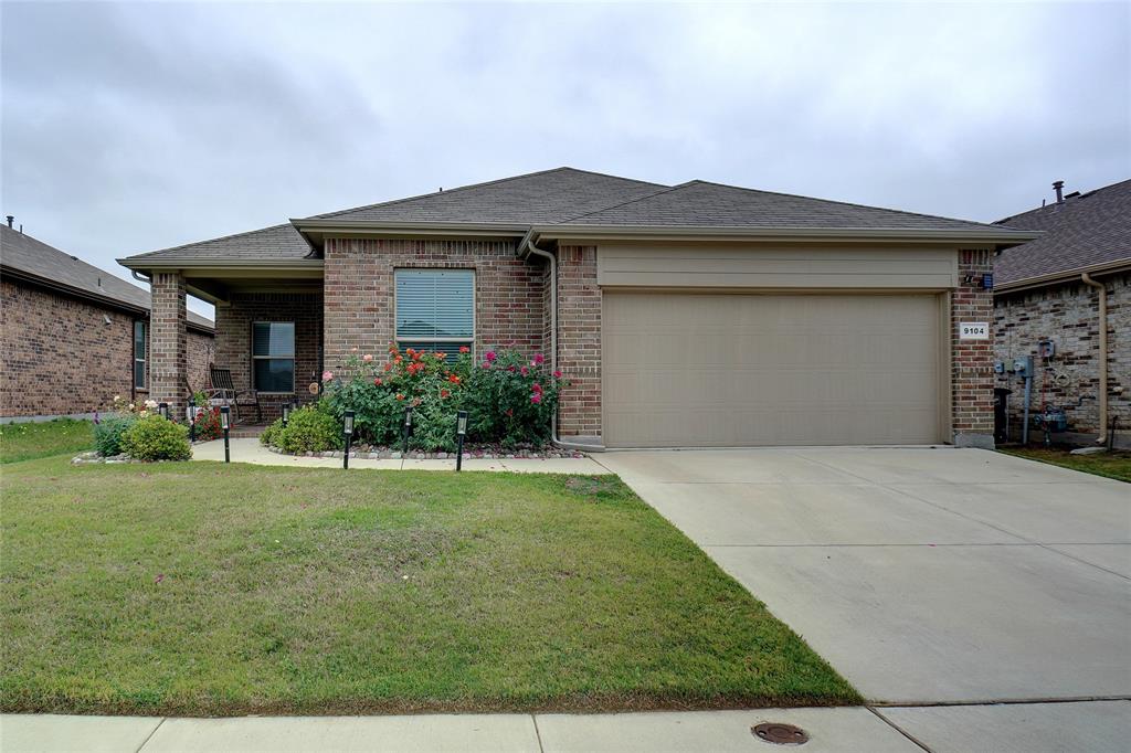 9104 Grovehurst Road Fort Worth, TX 76179 - Photo 1 of 1 a front view of a house with a yard and garage