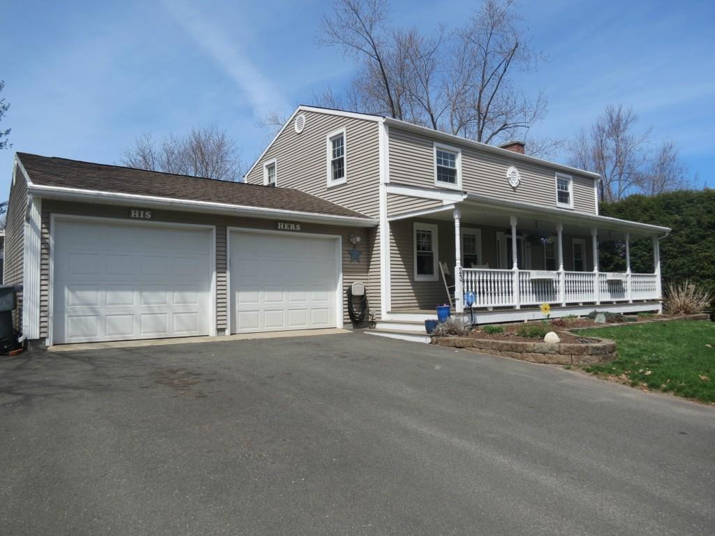 23 Buchanan Road Enfield, CT 06082 - Photo 1 of 1 a front view of a house with a garden and yard