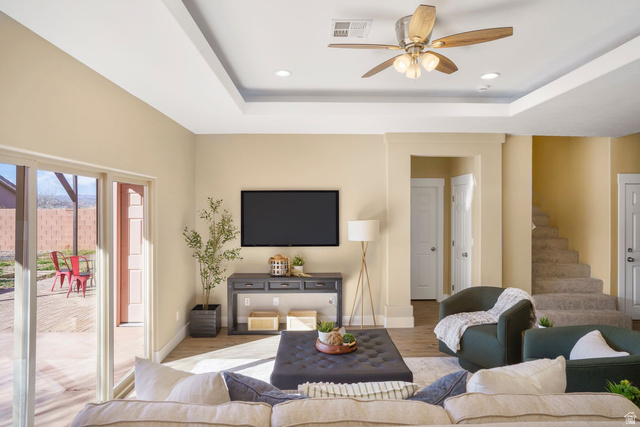 1570 South Rio Virgin Drive Washington, UT 84780 - Photo 24 of 71 Living room featuring wood finished floors, a tray ceiling, recessed lighting, and a ceiling fan