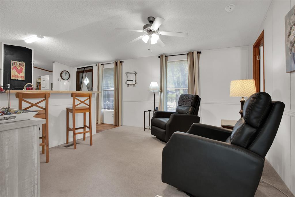 1793 Greer Road Sadler, TX 76264 - Photo 11 of 35 a living room with furniture and a chandelier