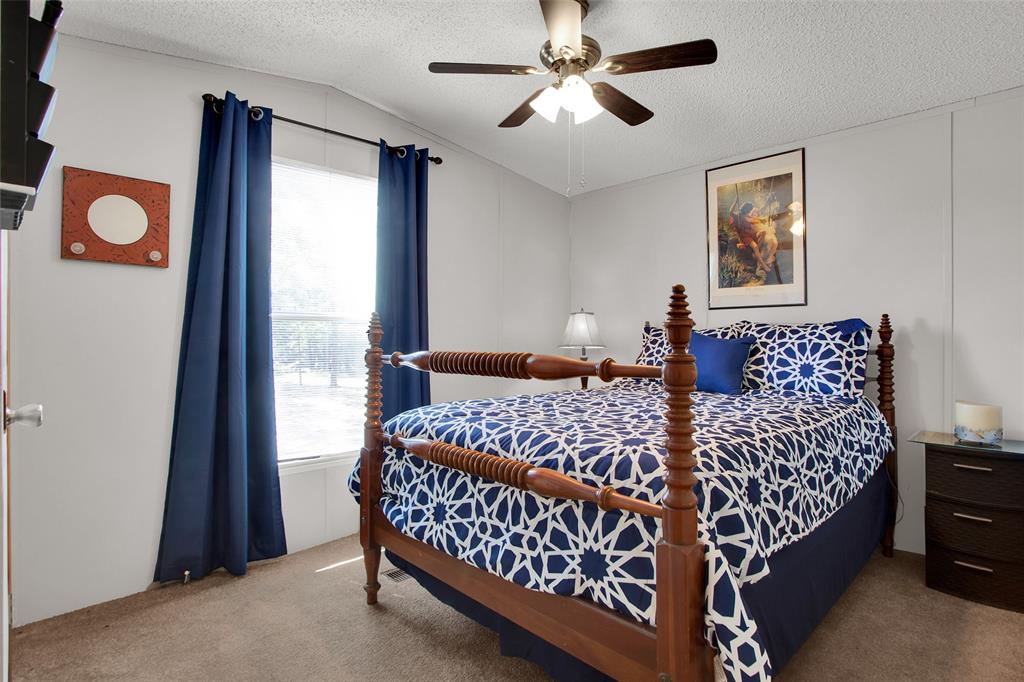 1793 Greer Road Sadler, TX 76264 - Photo 12 of 35 a bed sitting in a bedroom next to a window