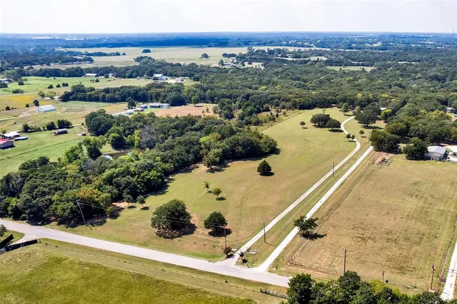 an aerial view of house with yard
