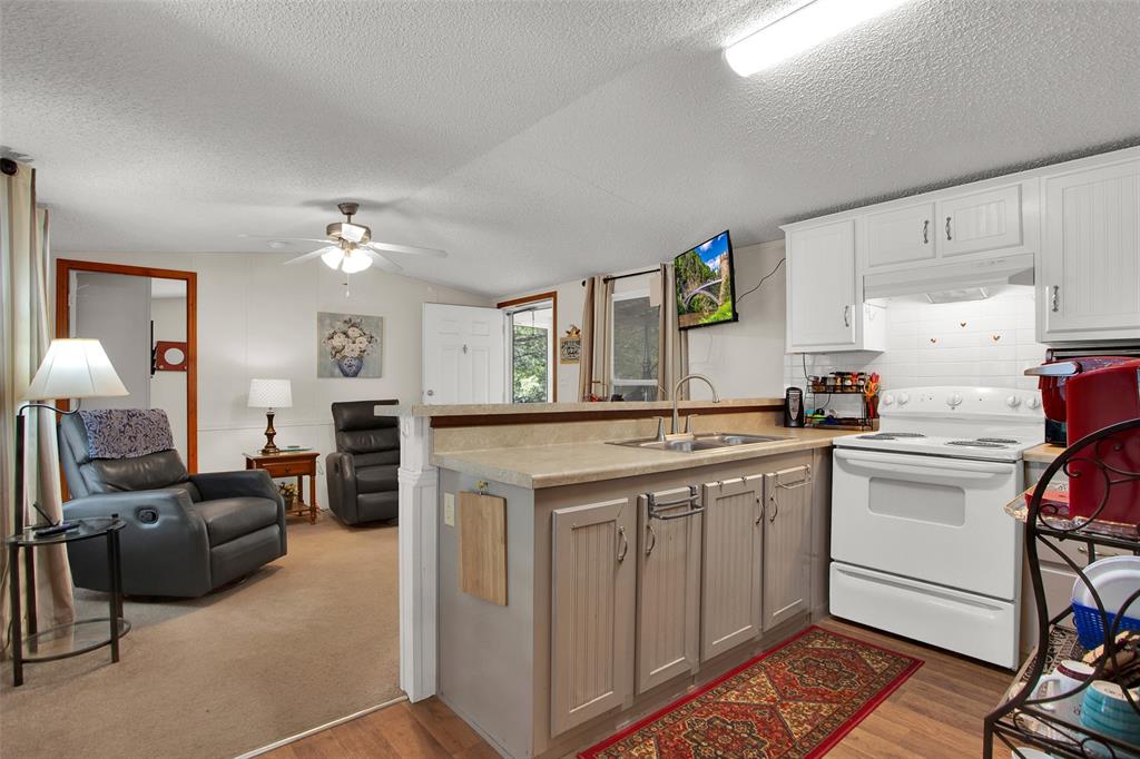 1793 Greer Road Sadler, TX 76264 - Photo 5 of 35 a kitchen with a sink cabinets and window