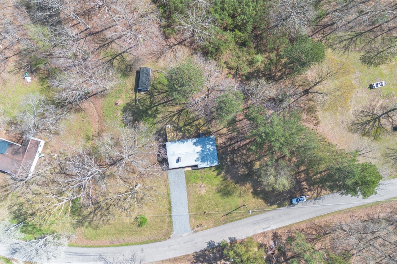2540 Grays Bend Road Centerville, TN 37033 - Photo 19 of 48 a view of a wooden house with a yard