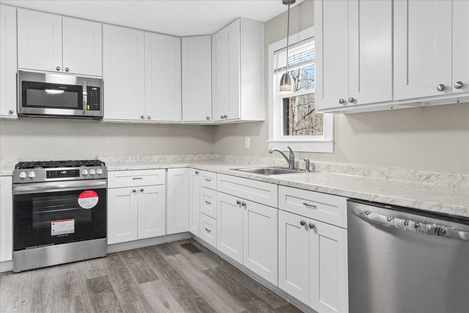 2540 Grays Bend Road Centerville, TN 37033 - Photo 29 of 48 a kitchen with granite countertop white cabinets and stainless steel appliances
