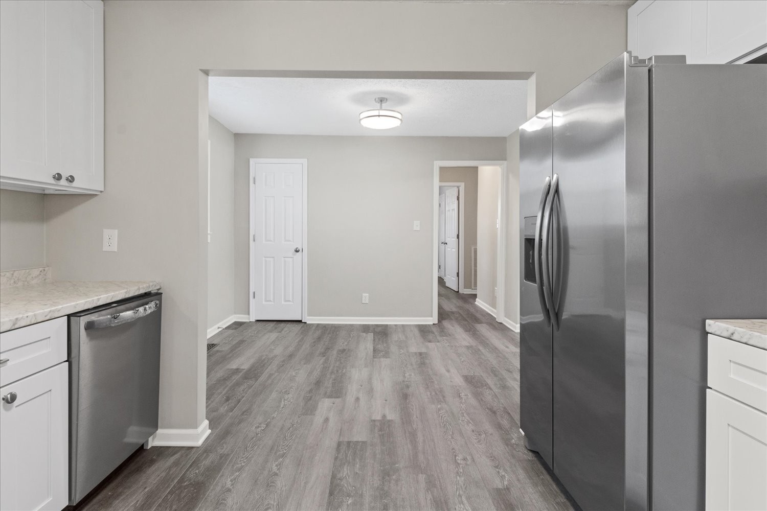2540 Grays Bend Road Centerville, TN 37033 - Photo 31 of 48 a view of a refrigerator in kitchen and wooden floor