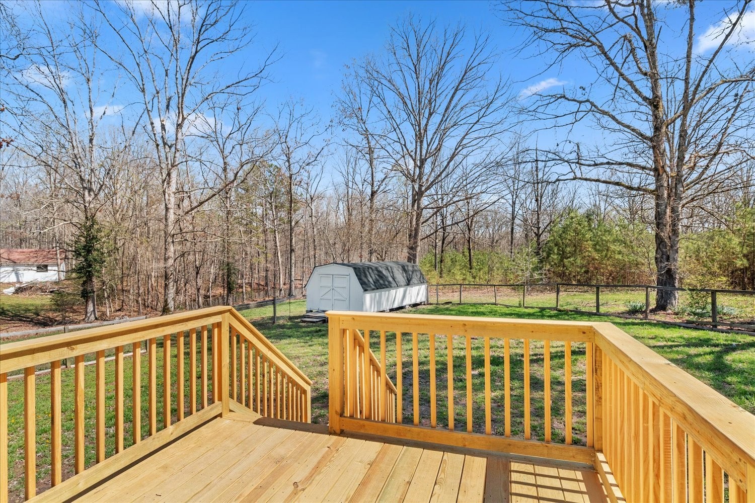2540 Grays Bend Road Centerville, TN 37033 - Photo 41 of 48 a view of a wooden deck with large trees