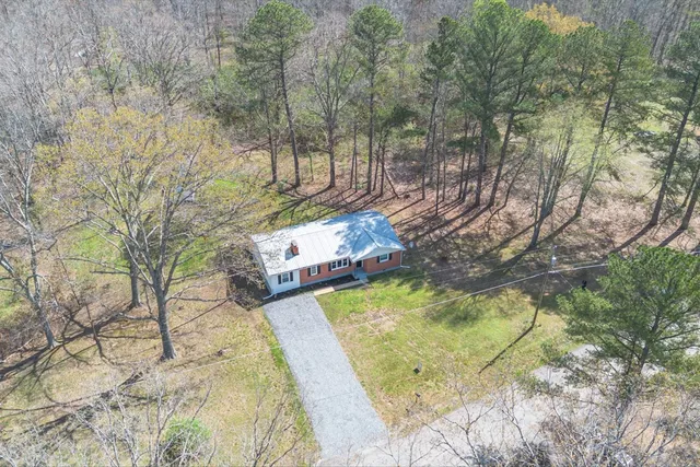a view of a swimming pool with a yard