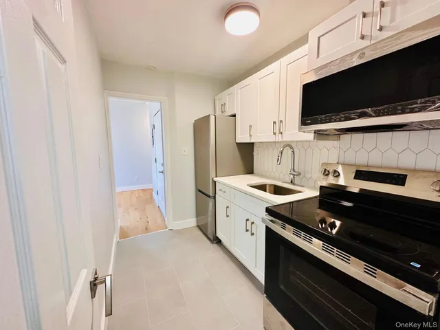 a kitchen with a stove and a microwave