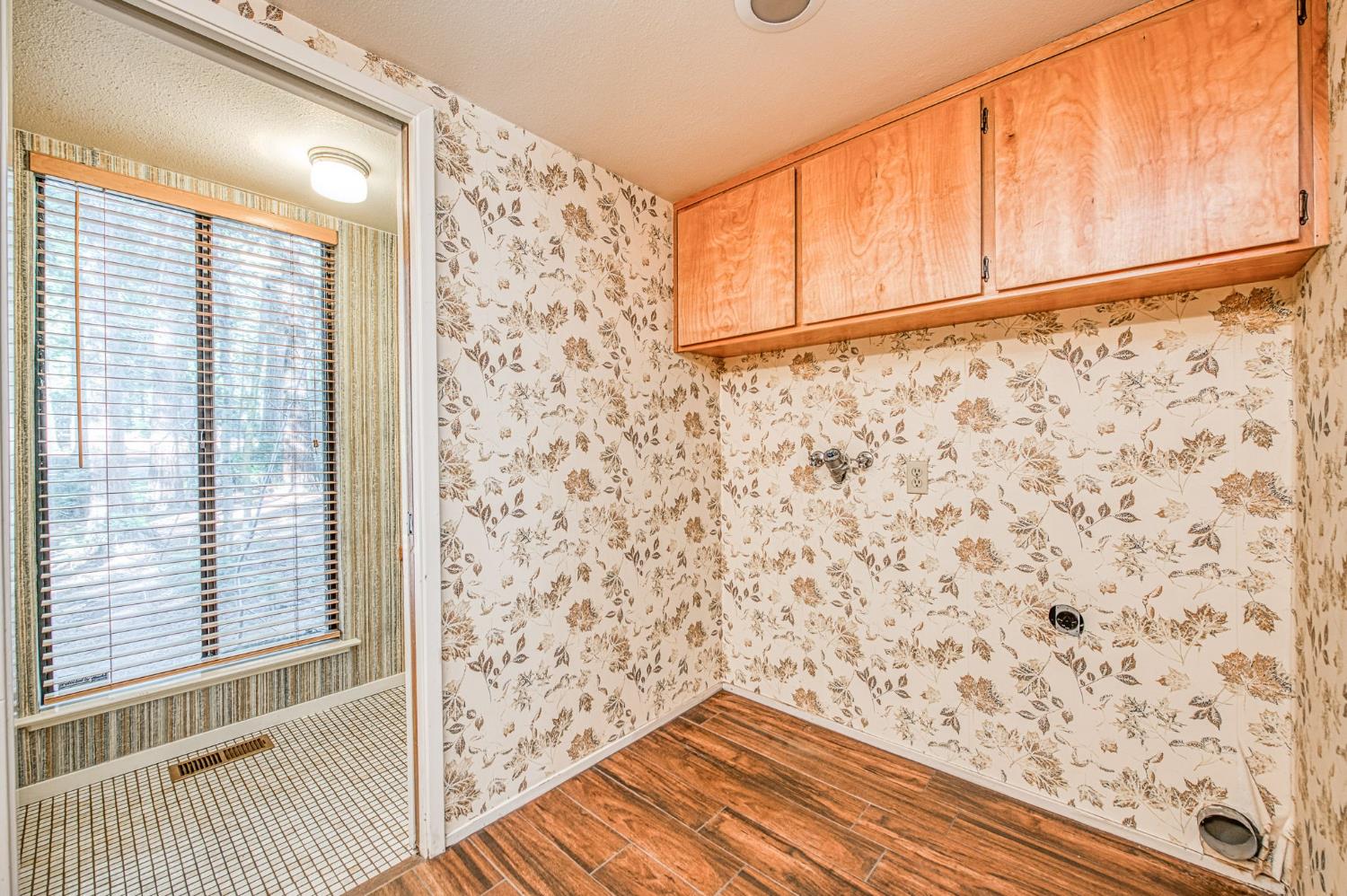 39326 Littlefield Road Shaver Lake, CA 93664 - Photo 20 of 49 a view of a room with wooden floor and shower