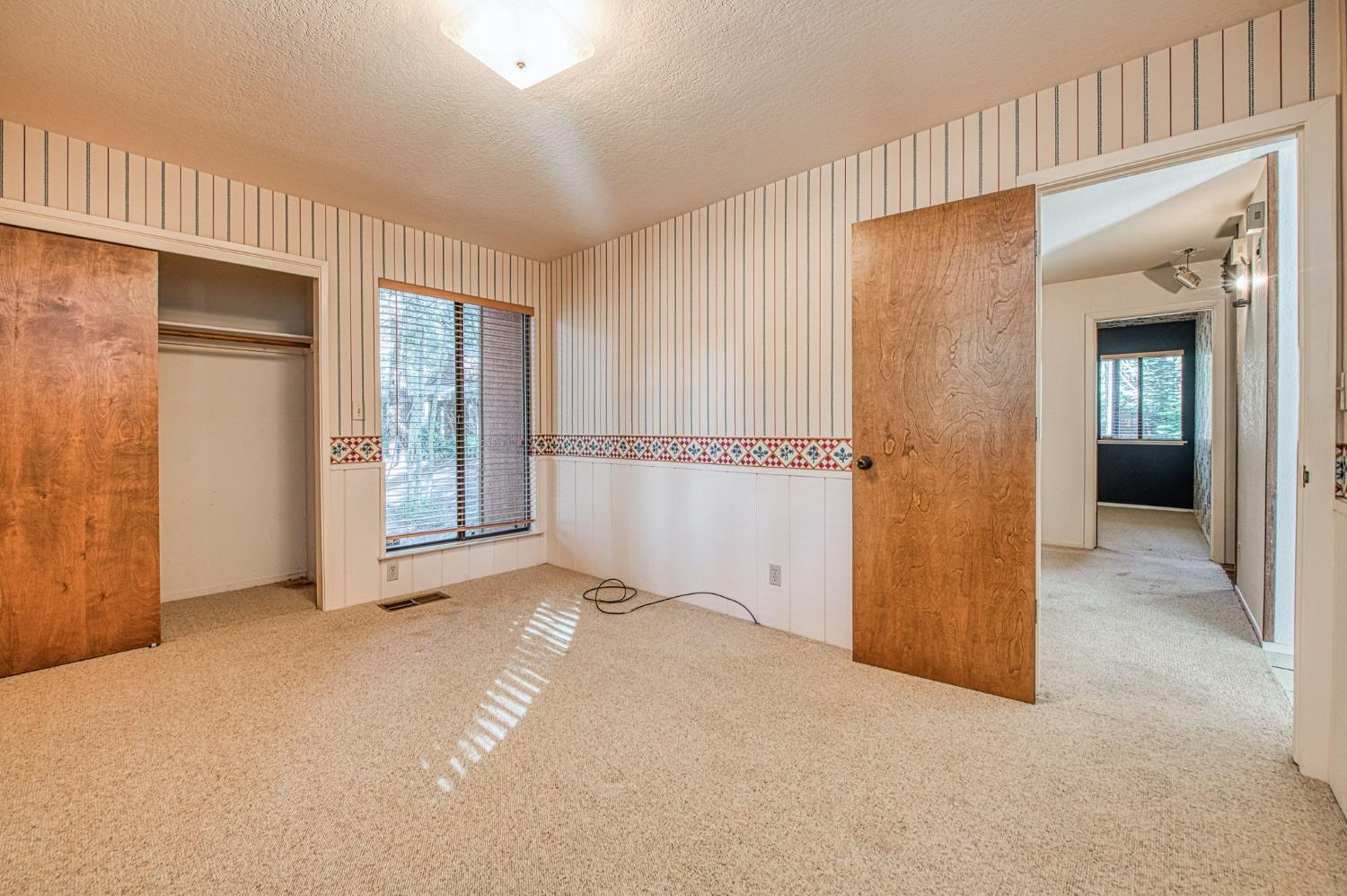 39326 Littlefield Road Shaver Lake, CA 93664 - Photo 25 of 49 an empty room with windows