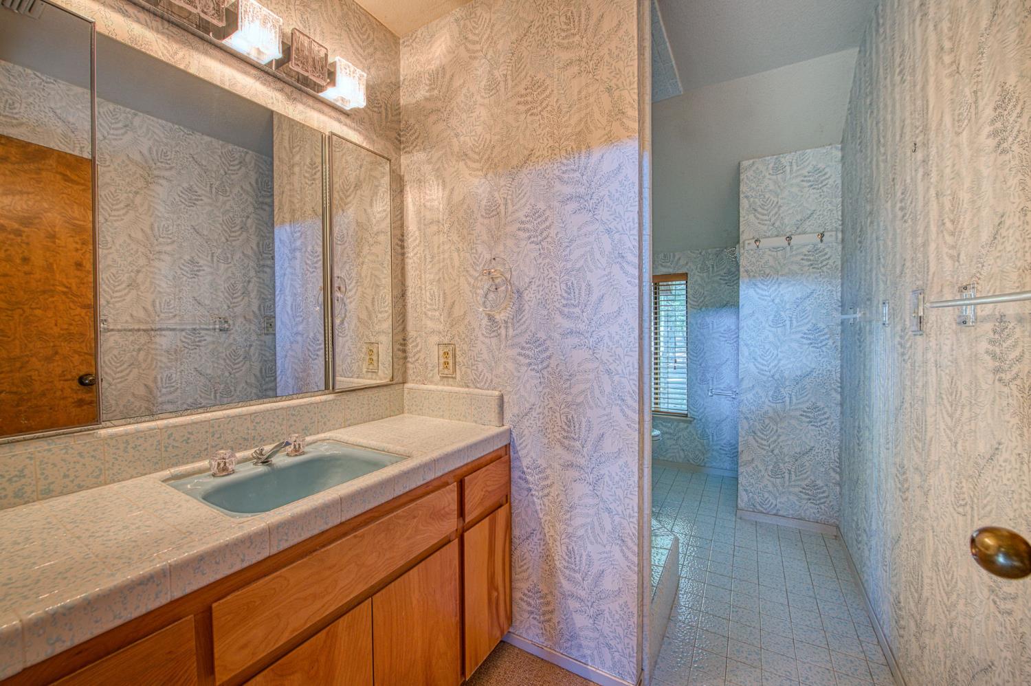 39326 Littlefield Road Shaver Lake, CA 93664 - Photo 33 of 49 a bathroom with a sink and a mirror